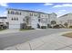Exterior street view of townhomes with front-facing garages and sidewalks at 612 Mclernon Trce, Johns Island, SC 29455
