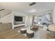 Bright living room with hardwood floors, large screen TV, and comfortable seating at 612 Mclernon Trce, Johns Island, SC 29455