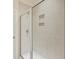 Bathroom shower features glass door, tiled walls, and shower caddy at 612 Mclernon Trce, Johns Island, SC 29455