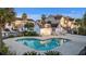 Exterior shot of a clear blue swimming pool surrounded by palm trees at 612 Mclernon Trce, Johns Island, SC 29455