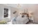 Comfortable bedroom with soft lighting, cozy bed linens, and a charming teddy bear, perfect for a restful night's sleep at 615 Red Monarch Way, Moncks Corner, SC 29461