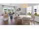 Inviting living space with ample natural light, open to the dining area and scenic outdoor views at 615 Red Monarch Way, Moncks Corner, SC 29461