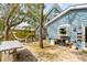 Inviting backyard deck featuring a hammock, dining area and view to the home at 619 E Erie Ave, Folly Beach, SC 29439