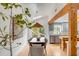 Bright dining room featuring a wooden table, skylight and a view to the kitchen at 619 E Erie Ave, Folly Beach, SC 29439