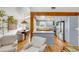 Open-concept kitchen with modern appliances, a center island, and seamless flow to dining and living areas at 619 E Erie Ave, Folly Beach, SC 29439