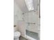 Tiled shower with a glass door and skylight at 619 E Erie Ave, Folly Beach, SC 29439