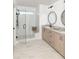 Elegant bathroom featuring a glass-enclosed shower, dual vanities, and modern fixtures at 641 Cottage Landing Dr, Summerville, SC 29485