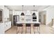 Modern kitchen featuring stainless steel appliances, white cabinetry, and an eat-in island at 641 Cottage Landing Dr, Summerville, SC 29485