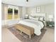 Tranquil main bedroom with natural light, neutral tones, decorative pillows, and a scenic view at 641 Cottage Landing Dr, Summerville, SC 29485