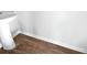 Bathroom featuring a pedestal sink, wood-look floors, and white base trim at 669 Silver Spruce St, Summerville, SC 29486