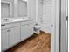 Bathroom featuring wood-look floors, a double sink vanity, and a shower-tub combo at 669 Silver Spruce St, Summerville, SC 29486