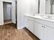 Bathroom featuring a double sink vanity with white cabinets and hard surface countertops at 669 Silver Spruce St, Summerville, SC 29486