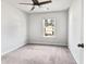 Bright bedroom with neutral carpet, ceiling fan, and window view at 669 Silver Spruce St, Summerville, SC 29486