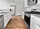 Modern kitchen with stainless steel appliances, granite countertops, and white cabinetry at 669 Silver Spruce St, Summerville, SC 29486