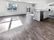 Spacious living area with hardwood floors, an open kitchen, and ample natural light at 669 Silver Spruce St, Summerville, SC 29486