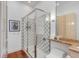 Bright bathroom features a glass enclosed shower and granite vanity at 90 E Bay St, Charleston, SC 29401