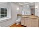 Bright bathroom features natural light, vanity with granite countertop, toilet, and window at 90 E Bay St, Charleston, SC 29401