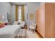 Bright bedroom with a large bed, sitting area, and ample natural light at 90 E Bay St, Charleston, SC 29401