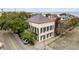 Elegant building in Charleston with black shutters, sidewalk and brick street and corner street location at 90 E Bay St, Charleston, SC 29401