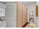 Bright hallway with hardwood floors, ample storage, and access to the bathroom at 90 E Bay St, Charleston, SC 29401