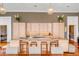 Modern kitchen island with granite counters and seating, featuring built-in appliances and stylish pendant lighting at 90 E Bay St, Charleston, SC 29401