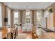 An open living space with seating areas, a dining table, and a gourmet island with hardwood flooring at 90 E Bay St, Charleston, SC 29401