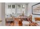 Cozy living room area with large windows, hardwood floors, and stylish furnishings at 90 E Bay St, Charleston, SC 29401