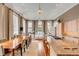 Open-concept living and dining area with an island, offering ample seating and lots of natural light at 90 E Bay St, Charleston, SC 29401