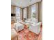 Bright and airy living room with hardwood floors, featuring a modern seating area and view of the dining area at 90 E Bay St, Charleston, SC 29401
