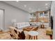 Bright living room with exposed brick accents, a plush white sofa, and stylish, eye-catching decor at 90 E Bay St, Charleston, SC 29401