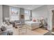 Spacious main bedroom with a sitting area, two large windows, and a comfortable queen bed at 90 E Bay St, Charleston, SC 29401