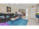 Inviting living room with a plush blue rug, comfortable seating, and stylish decor at 925 Dills Bluff Rd # 34, Charleston, SC 29412