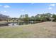 Scenic pond view with fountain, surrounded by trees, offering a peaceful community setting at 925 Dills Bluff Rd # 34, Charleston, SC 29412