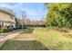 Large backyard with lush greenery, mature trees, and manicured lawn at 941 Law Ln, Mount Pleasant, SC 29464