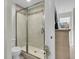 Updated bathroom features a glass-enclosed shower and sleek fixtures with a view of nature at 941 Law Ln, Mount Pleasant, SC 29464