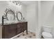 A modern bathroom boasts double vessel sinks, decorative mirrors, and a sleek design at 941 Law Ln, Mount Pleasant, SC 29464