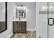 Bathroom features a modern vanity, stylish mirror, and a glass-enclosed shower with attractive tile at 941 Law Ln, Mount Pleasant, SC 29464