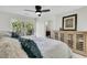 Serene bedroom with a scenic view, a ceiling fan, and ample closet space at 941 Law Ln, Mount Pleasant, SC 29464