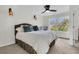 A tranquil bedroom features a ceiling fan, a comfortable bed, and a scenic view at 941 Law Ln, Mount Pleasant, SC 29464