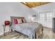 Bright bedroom with vaulted wood ceiling, comfy bed, and an exterior door to let the sunshine in at 941 Law Ln, Mount Pleasant, SC 29464