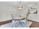 Charming dining area with a round table, four chairs, and an attractive chandelier above at 941 Law Ln, Mount Pleasant, SC 29464