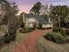 Charming home with a spacious driveway and beautifully landscaped yard at 941 Law Ln, Mount Pleasant, SC 29464