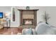 Living room fireplace with decorative mantel, tiled surround, and hardwood floors at 941 Law Ln, Mount Pleasant, SC 29464