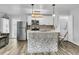 Bright kitchen with stainless steel appliances, mosaic backsplash, and breakfast bar seating at 941 Law Ln, Mount Pleasant, SC 29464