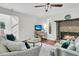 Bright living room with a fireplace, comfortable seating, and hardwood floors at 941 Law Ln, Mount Pleasant, SC 29464