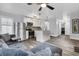 Open-concept living room and kitchen with stainless steel appliances, modern finishes, and hardwood floors at 941 Law Ln, Mount Pleasant, SC 29464
