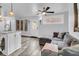 Comfortable living room featuring a plush grey sofa, wood floors, and stylish wall decor at 941 Law Ln, Mount Pleasant, SC 29464