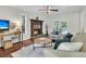Cozy living room with a fireplace, comfortable seating, and hardwood floors at 941 Law Ln, Mount Pleasant, SC 29464