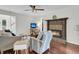 Inviting living room with a fireplace, comfortable seating, and hardwood floors at 941 Law Ln, Mount Pleasant, SC 29464