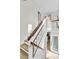 Elegant staircase with wood railings leads to a bright, open landing with great natural light at 941 Law Ln, Mount Pleasant, SC 29464